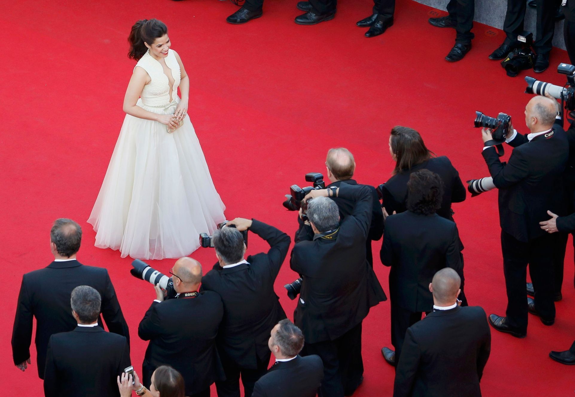 Cast member America Ferrera poses on the red carpet as she arrives for the screening of the film &quot;How to Train Your Dragon 2&quot; out of competition at the 67th Cannes Film Festival in Cannes