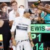 Mercedes Formula One driver Lewis Hamilton of Britain is sprayed with champagne by his team after his win in the Bahrain F1 Grand Prix at the Bahrain International Circuit (BIC) in Sakhir