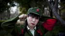 Xiao Cao, a 57-year-old gay man, prepares for his dance performance as a cultural revolution red guard at a park in Shanghai March 13, 2012. China's gay community has long been on the edges of society but it is gradually becoming more accepted. Cao, who is an unemployed drag queen, is one whose life lifts the curtain on a less romanticised view of Chinese homosexuals. Living in an eight-square-metre apartment behind a public toilet and with a monthly income of 500 yuan ($79) from social insurance, he passes his days dancing in public and spending time with friends at gay clubs. Picture taken March 13, 2012. REUTERS/Aly Song (CHINA - Tags: SOCIETY) CHINA OUT. NO COMMERCIAL OR EDITORIAL SALES IN CHINA. ATTENTION EDITORS PICTURE 11 OF 28 OF PACKAGE 'GAY AND OUT IN CHINA' TO FIND ALL IMAGES SEARCH 'GAY OUT CHINA' Published: Čer. 1, 2012, 12:37 dop.