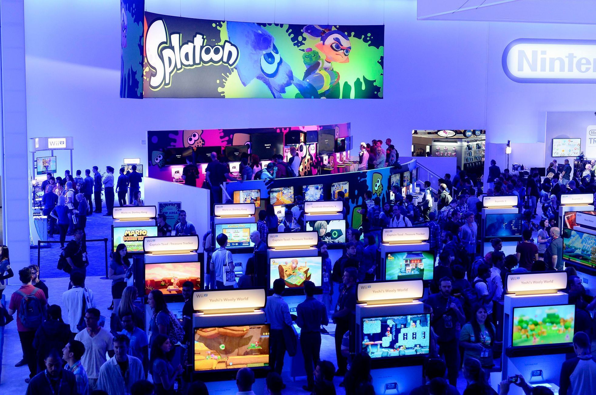 Attendees play video games in the Nintendo booth at the 2014 Electronic Entertainment Expo, known as E3, in Los Angeles