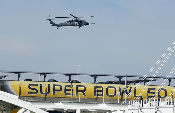 A U.S. military helicopter patrols before NFL Super Bowl 50 outside Levi's Stadium in Santa Clara, California,