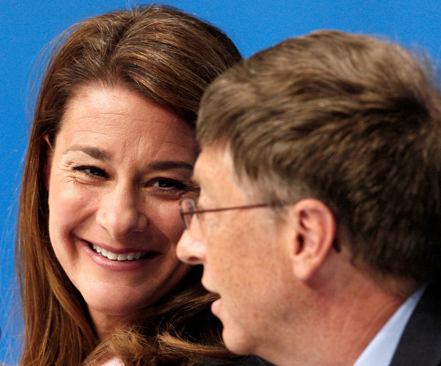 FILE PHOTO: Melinda Gates smiles at husband during the opening news conference for AIDS 2006 in Toronto