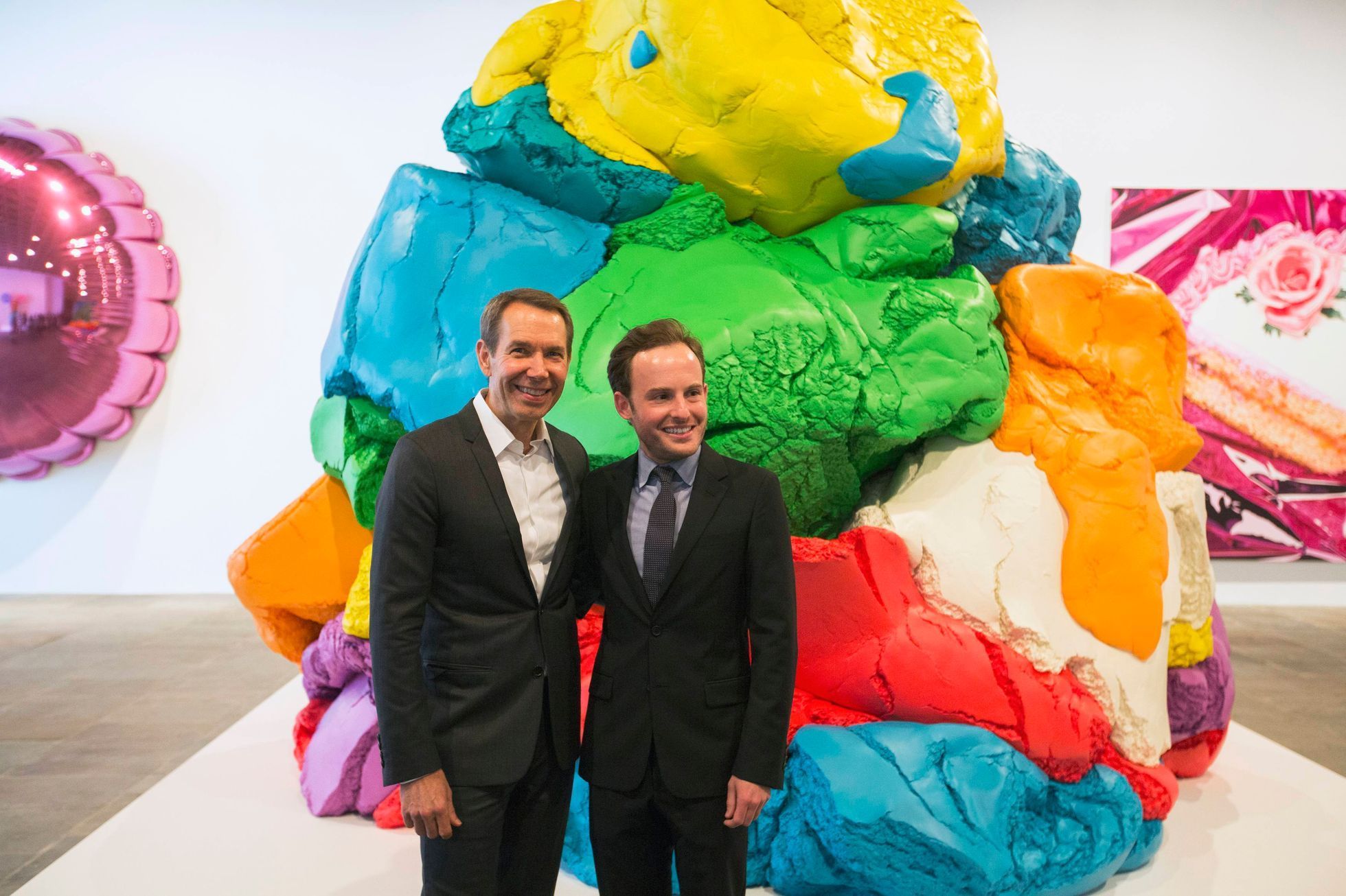 Artist Jeff Koons poses with Scott Rothkopf, the associate director of programs at the Whitney, during a press preview in New York