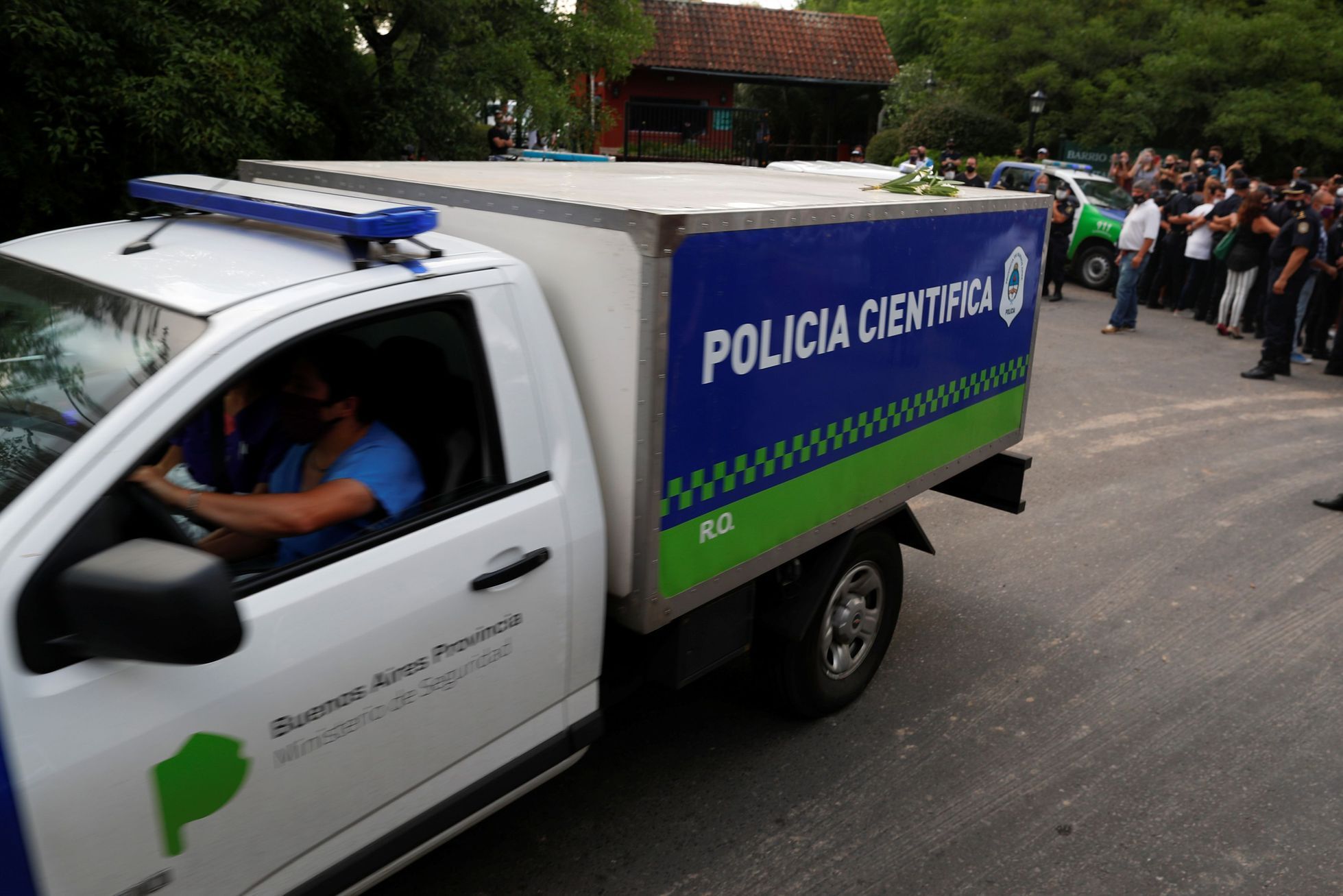 A scientific police vehicle carrying the body of Argentine great Diego Maradona leaves the house where he was staying