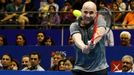 Singapore Slammers' Andre Agassi of the U.S. hits a return to Manila Mavericks' Mark Philippoussis of Australia during their men's singles match at the International Prem