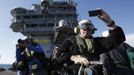 Members of the media take pictures and footage of an X-47B pilot-less drone combat aircraft before it is launched for the first time off an aircraft carrier, the USS George H. W. Bush, in the Atlantic Ocean off the coast of Virginia, May 14, 2013. The U.S. Navy made aviation history on Tuesday by catapulting an unmanned jet off an aircraft carrier for the first time, testing a long-range, stealthy, bat-winged plane that represents a jump forward in drone technology. REUTERS/Jason Reed (UNITED STATES - Tags: MILITARY SCIENCE TECHNOLOGY) Published: Kvě. 14, 2013, 6:59 odp.