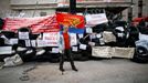 A pro-Russia protester stands at a barricade outside a regional government building in Donetsk, in eastern Ukraine April 15, 2014.