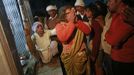 A Hindu priest pulls back a devotee who is believed to be possessed by evil spirits before hitting her with a broom as she goes into a state of trance at Guru Deoji Maharaj temple during a ghost fair at Malajpur village in Betul district in the central Indian state of Madhya Pradesh January 26, 2013. People from across India come to this fair to be exorcised of �evil spirits�. They are usually brought by relatives and they are most often women. The exorcism involves running around the temple courtyard to make the 'ghost' weak then being beaten by a priest with a broom. Picture taken January 26, 2013. REUTERS/Danish Siddiqui (INDIA - Tags: SOCIETY RELIGION) ATTENTION EDITORS: PICTURE 19 OF 24 FOR PACKAGE 'INDIAN GHOSTBUSTERS' SEARCH 'INDIA GHOST' FOR ALL IMAGES Published: Úno. 5, 2013, 5:10 dop.