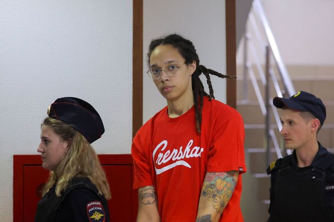 U.S. basketball player Brittney Griner, who was detained in March at Moscow's Sheremetyevo airport and later charged with illegal possession of cannabis, is escorted befo