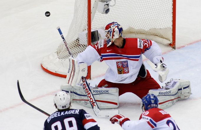 Goalie Alexander Salak of the Czech Republic saves a shot from Justin Abdelkader of the U.S. (L) during their men's ice hockey World Championship quarter-final game at Ch