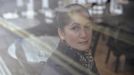 Katarina Germanou poses for a photograph in the Byzantium Cafe where she works as a waitress in west London