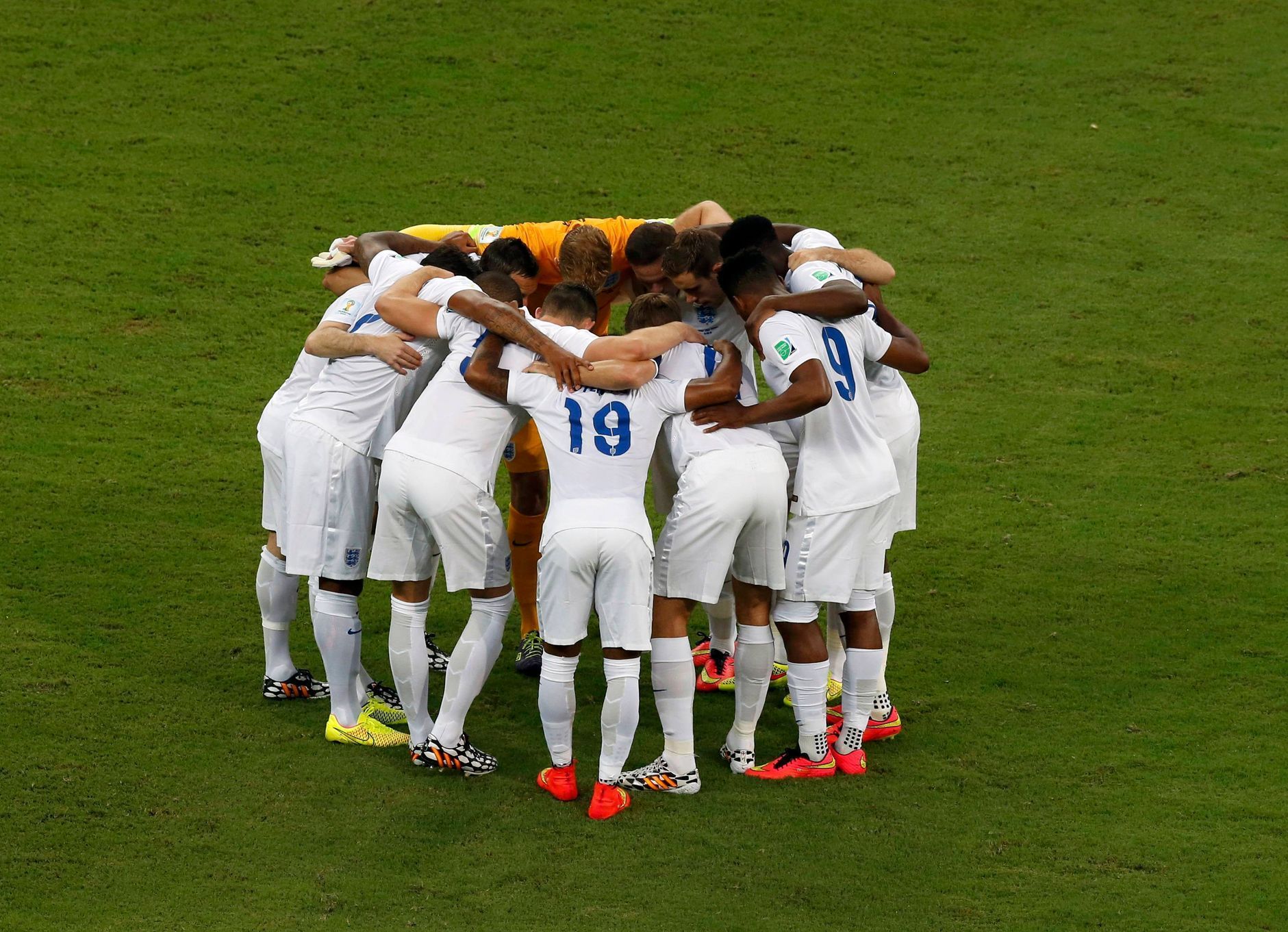 England players huddle before their 2014 World Cup Group D soccer match against Italy at the Amazonia arena in Manaus