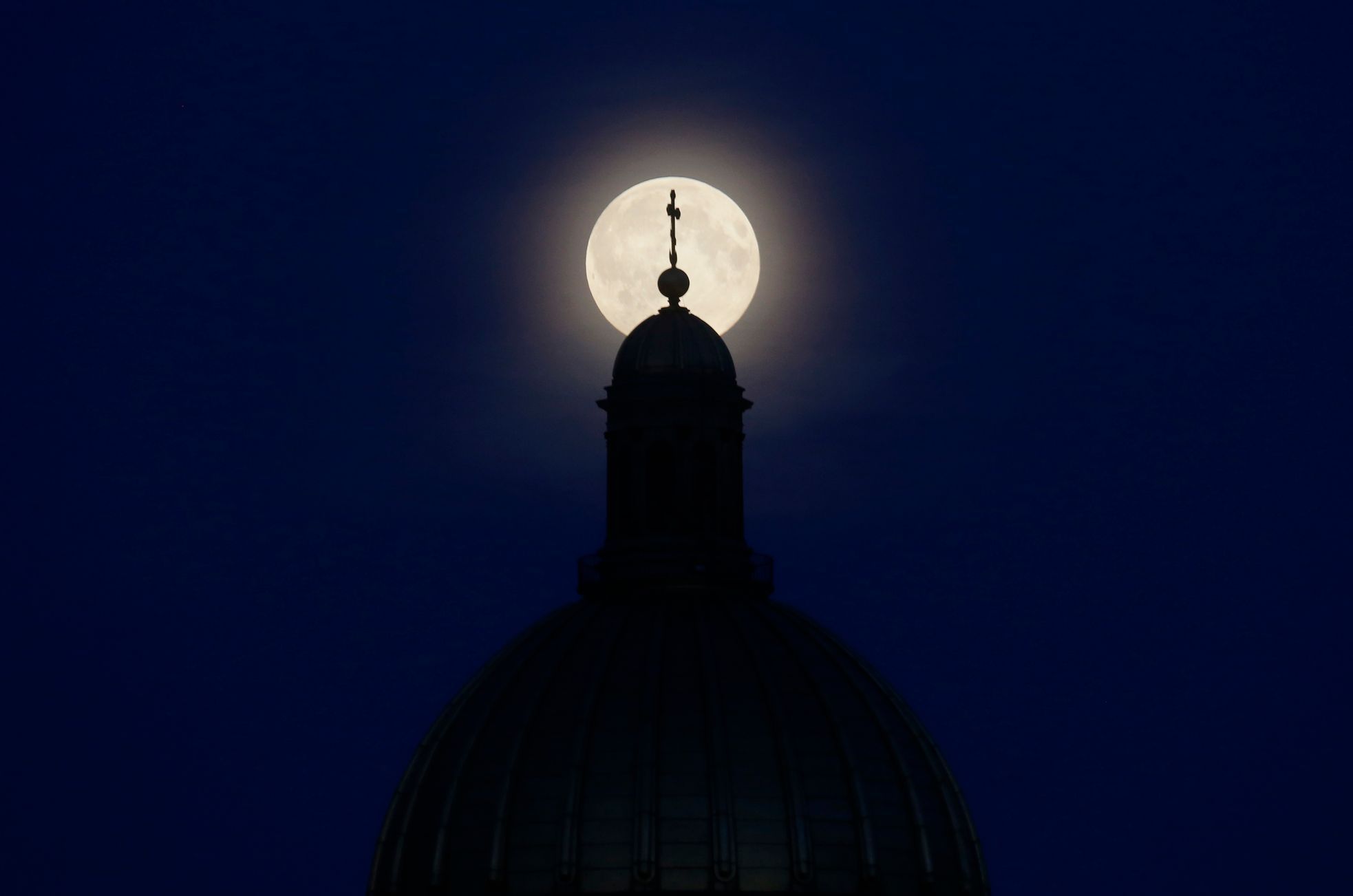 Supermoon is seen behind the St. Isaac's Cathedral in St. Petersburg