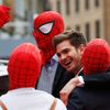 Actor Andrew Garfield messes around with friends dressed in Spider Man masks at the world premiere of The Amazing Spiderman 2 in central London
