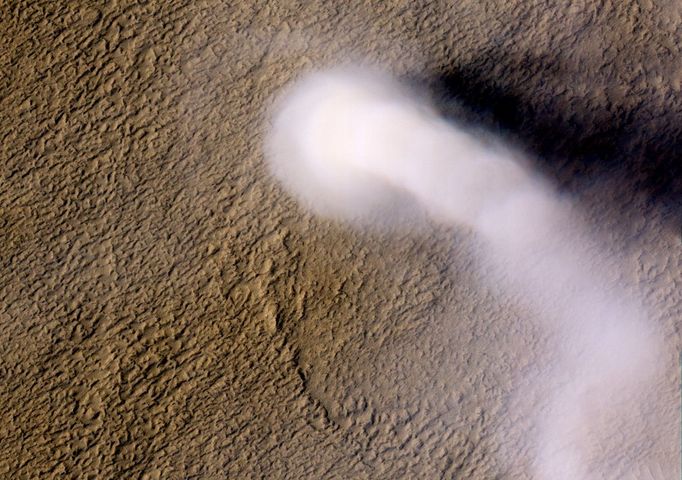 The Serpent Dust Devil of Mars A towering dust devil casts a serpentine shadow over the Martian surface in this image acquired by the High Resolution Imaging Science Experiment (HiRISE) camera on NASA's Mars Reconnaissance Orbiter. The scene is a late-spring afternoon in the Amazonis Planitia region of northern Mars. The view covers an area about four-tenths of a mile (644 meters) across. North is toward the top. The length of the dusty whirlwind's shadow indicates that the dust plume reaches more than half a mile (800 meters) in height. The plume is about 30 yards or meters in diameter. A westerly breeze partway up the height of the dust devil produced a delicate arc in the plume. The image was taken during the time of Martian year when the planet is farthest from the sun. Just as on Earth, winds on Mars are powered by solar heating. Exposure to the sun's rays declines during this season, yet even now, dust devils act relentlessly to clean the surface of freshly deposited dust, a little at a time. This view is one product from an observation made by HiRISE on Feb. 16, 2012, at 35.8 degrees north latitude, 207 degrees east longitude. Other image products from the same observation are at http://www.uahirise.org/ESP_026051_2160 . HiRISE is one of six instruments on NASA's Mars Reconnaissance Orbiter. The University of Arizona, Tucson, operates the orbiter's HiRISE camera, which was built by Ball Aerospace & Technologies Corp., Boulder, Colo. NASA's Jet Propulsion Laboratory, a division of the California Institute of Technology in Pasadena, manages the Mars Reconnaissance Orbiter Project for the NASA Science Mission Directorate, Washington. Lockheed Martin Space Systems, Denver, built the spacecraft. Image credit: NASA/JPL-Caltech/Univ. of Arizona