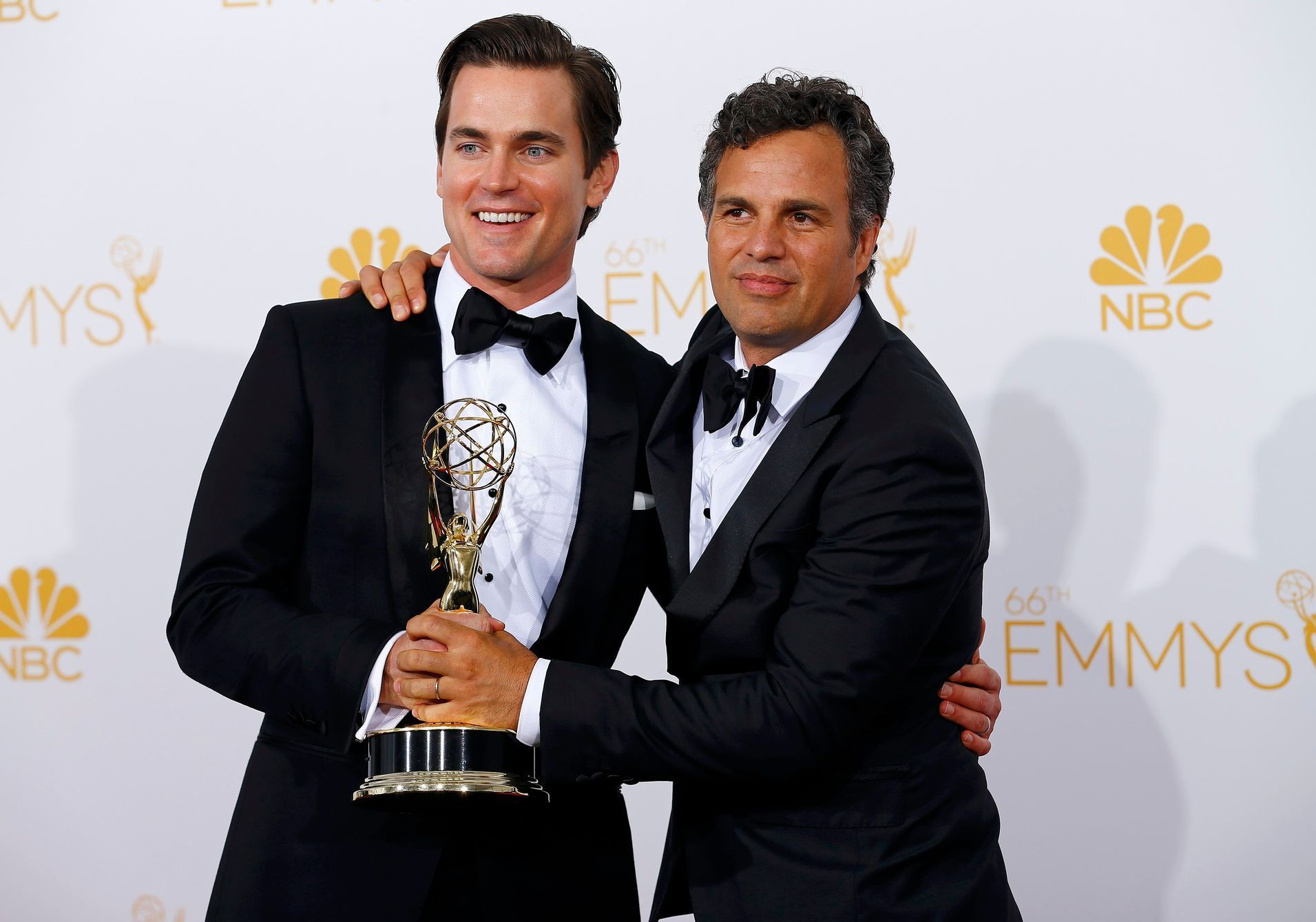 Matt Bomer and Mark Ruffalo pose with their Outstanding Television Movie award for HBO's &quot;The Normal Heart&quot; at the 66th Primetime Emmy Awards in Los Angeles