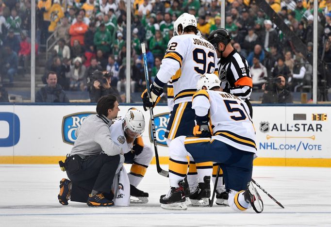 Jan 1, 2020; Dallas, TX, USA; Nashville Predators defenseman Ryan Ellis (4) is helped up off the ice after an injury against the Dallas Stars during the first period in t