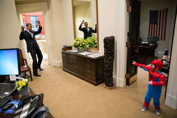 Oct. 26, 2012 "The President pretends to be caught in Spider-Man's web as he greets the Nicholas Tamarin, 3, just outside the Oval Office. Spider-Man had been trick-or-treating for an early Halloween with his father, White House aide Nate Tamarin in the Eisenhower Executive Office Building. I can never commit to calling any picture my favorite, but the President told me that this was HIS favorite picture of the year when he saw it hanging in the West Wing a couple of weeks later."