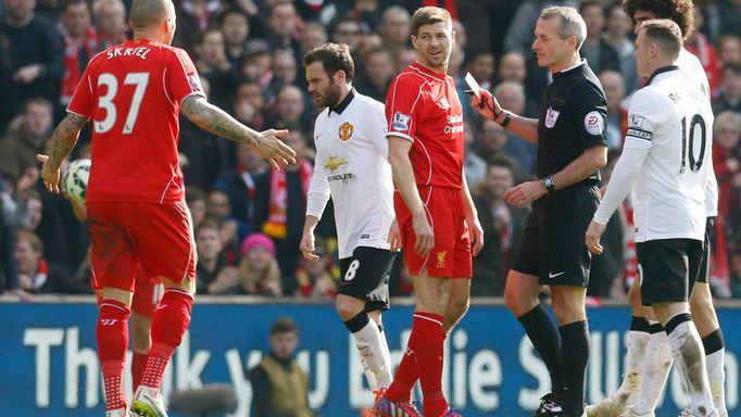 Football: Liverpool's Steven Gerrard is shown a red card by referee Martin Atkinson