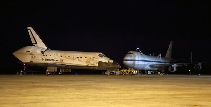 Space shuttle Discovery is being towed for the last time out of the Vehicle Assembly Building to the Mate Demate Facility at Kennedy Space Center