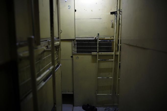 Wooden boxes, where people live in, are marked with numbers in Hong Kong October 9, 2012. In Hong Kong's middle-class residential area, short distance from its shopping and financial districts, 24 people live in these wooden boxes, or "coffin homes", packed in a single apartment of little over 50 square meters. Its residents pay 1450 Hong Kong dollars ($180) for their living space built of wooden panels of 2 meters by 70 cm. To maximize income from the rent in central Hong Kong landlords build "coffin homes", nicknamed due to their resemblance to real coffins. Space has always been at a premium in Hong Kong where developers plant high-rises on every available inch. REUTERS/Damir Sagolj (CHINA - Tags: SOCIETY REAL ESTATE BUSINESS) Published: Říj. 9, 2012, 2:03 odp.