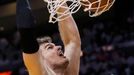 San Antonio Spurs' Tiago Splitter dunks against the Miami Heat during the second quarter in Game 7 of their NBA Finals basketball playoff in Miami, Florida June 20, 2013.