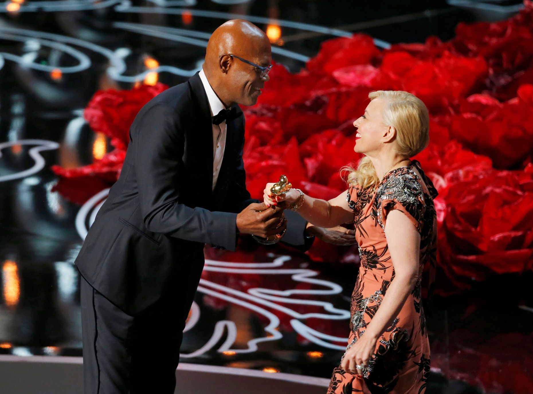 Jackson presents the award for best costume to Martin for her work in &quot;The Great Gatsby&quot; at the 86th Academy Awards in Hollywood