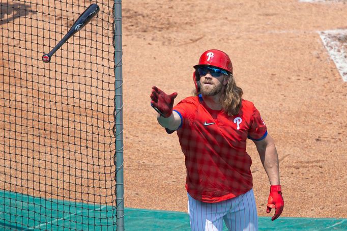 Jul 6, 2020; Philadelphia, Pennsylvania, United States; Philadelphia Phillies right fielder Bryce Harper catches a bat during workouts at Citizens Bank Park. Mandatory Cr