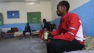 Somali athletes drink water and rest inside their room after training during preparations for the 2012 London Olympic Games in Somalia's capital Mogadishu March 14, 2012 file photo. Training in a bullet-riddled stadium where the remains of a rocket propelled grenade lies discarded on the track's edge counts as progress for Somali Olympic hopeful Mohamed Hassan Mohamed. A year ago, Mogadishu's Konis stadium was a base for Islamist militants and a work out meant at times running through the streets, dodging gun-fire and mortar shells in one of the world's most dangerous cities. To match OLY-SOMALIA-HOPES/ REUTERS/Feisal Omar/Files (SOMALIA - Tags: SPORT ATHLETICS SOCIETY OLYMPICS) Published: Čer. 11, 2012, 6:52 dop.