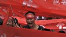 Demonstrators hold Chinese flags and banners as they yell slogans during a protest in Kunming, Yunnan province, September 15, 2012. Thousands of protesters besieged the Japanese embassy in Beijing on Saturday, hurling rocks and bottles at the building as police struggled to keep control, amid growing tensions between Asia's two biggest economies over a group of disputed islands. The Chinese characters on the headband read, "Dioayu Islands belong to China." REUTERS/Wong Campion (CHINA - Tags: MILITARY POLITICS TPX IMAGES OF THE DAY)