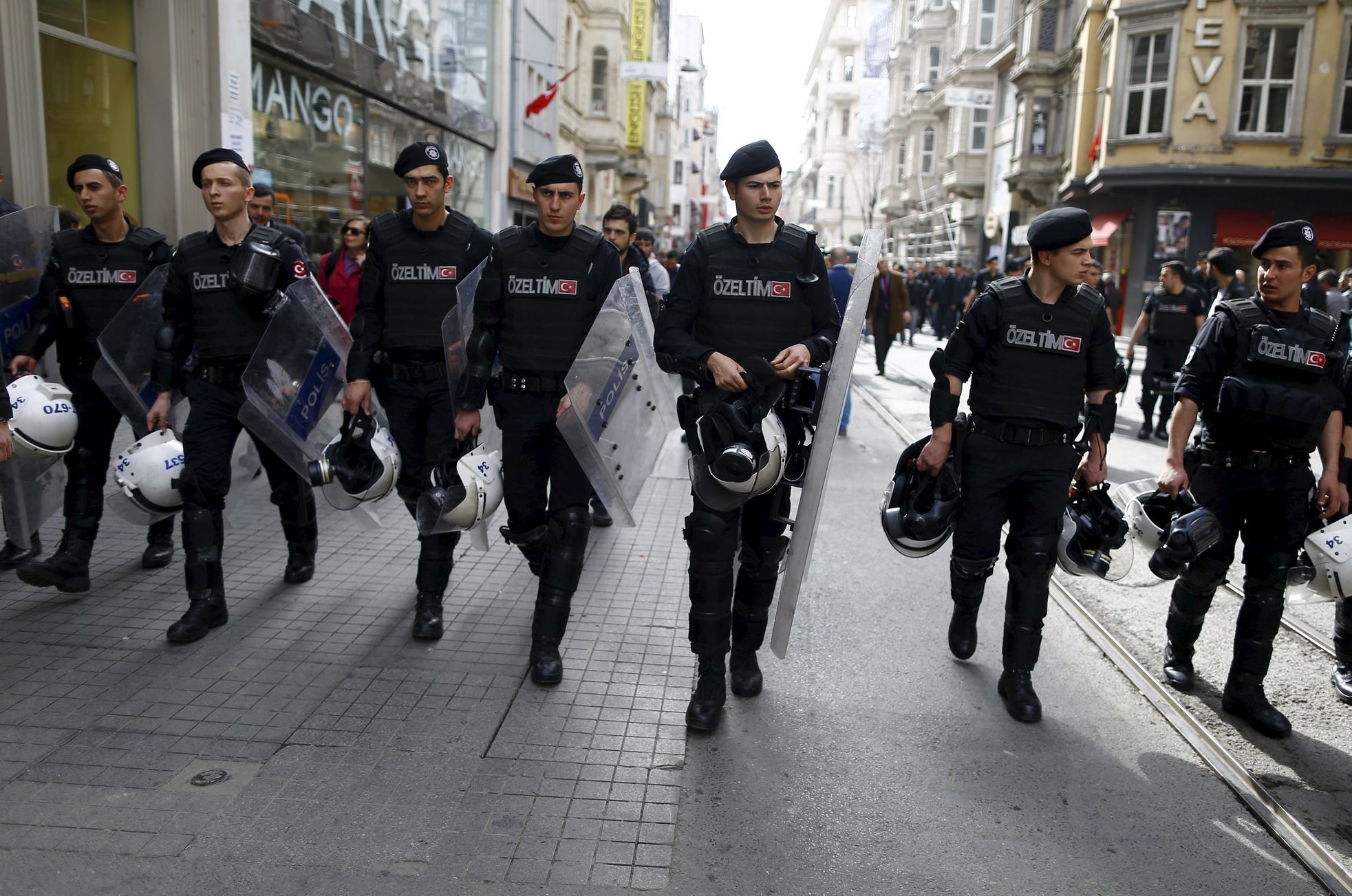 Riot police secure the area as representatives of foreign missions march in Istiklal street during a protest against Saturday's suicide bombing, in central Istanbul