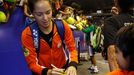 Team Micromax Indian Aces' Ana Ivanovic of Serbia signs autographs after matches against UAE Royals at the International Premier Tennis League (IPTL) in Singapore Decembe