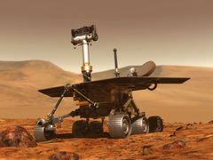 Povrch rudé planety úspěšně zkoumají automaty - na obrázku malířova představa práce vozítka Spirit.