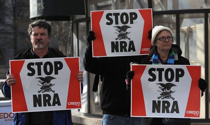 People protest the National Rifle Association of America (NRA) news conference in front of the Willard Hotel, near the White House December 21, 2012 in Washington, DC. Photo by Olivier Douliery/ABACAUSA.com