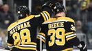 Feb 4, 2025; Boston, Massachusetts, USA; Boston Bruins right wing David Pastrnak (88) congratulates center Morgan Geekie (39) after scoring an empty net goal during the t