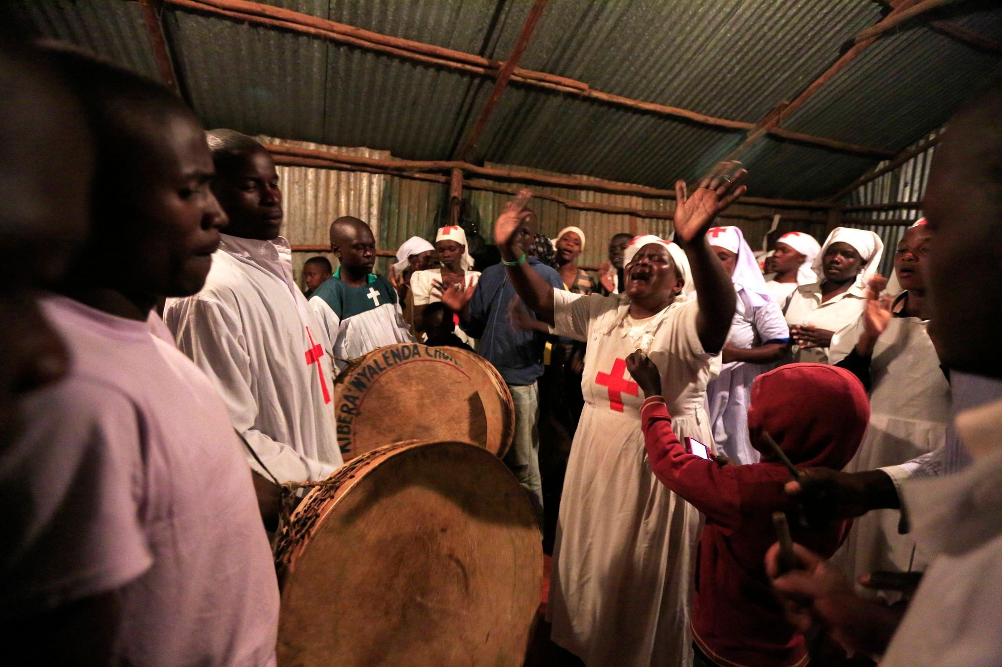 Members of the Musanda Holy Ghost Church in Kibera pray during New Year's celebrations in Nairobi