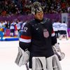 Team USA's goalie Quick leaves the ice after being defeated by Finland during the third period of their men's ice hockey bronze medal game at the Sochi 2014 Winter Olympic Games