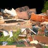Debris from a damaged home is seen after a tornado hit the town of Mayflower, Arkansas