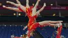 Huang Qiushuang of China attends a gymnastics training session at the North Greenwich Arena before the start of the London 2012 Olympic Games July 26, 2012. This picture was taken using multiple exposures. REUTERS/Brian Snyder (BRITAIN - Tags: SPORT OLYMPICS SPORT GYMNASTICS) Published: Čec. 26, 2012, 5:50 odp.