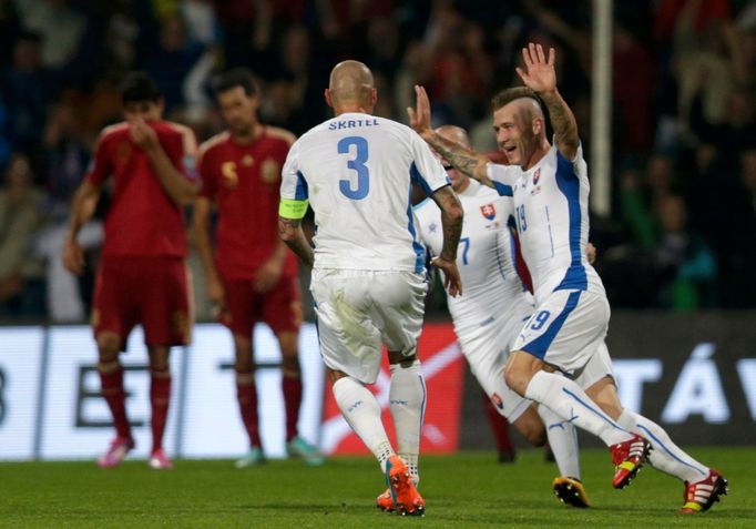 Kucka of Slovakia celebrates his goal against Spain with team mates during their Euro 2016 qualification soccer match at the MSK stadium in Zilina