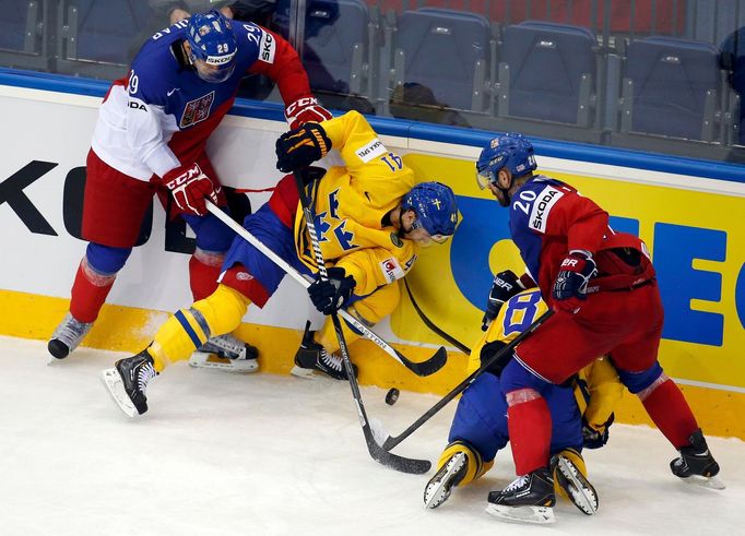 Sweden's Gustav Nyquist (2nd L) and Linus Klasen (2nd R) protect the puck from the Czech Republic's Jan Kolar (L) and Jakub Klepis (R) during the third period of their me