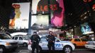 New York City Police officers stand guard outside the Times Square Subway station after the trains had been shut down New York, October 28, 2012. Authorities shut transit systems and ordered some evacuations as tens of millions of people on the East Coast braced for Hurricane Sandy, a gigantic storm forecast to deliver battering winds, dangerous flooding and even heavy snowfall. REUTERS/Brendan McDermid (UNITED STATES - Tags: DISASTER ENVIRONMENT TPX IMAGES OF THE DAY)