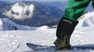 A snowboarder gets ready for a training ride at "Peak Rosa" of Rosa Khutor, a venue for the Sochi 2014 Winter Olympics, near Sochi February 14, 2013. Although many complexes and venues in the Black Sea resort of Sochi mostly resemble building sites that are still under construction, there is nothing to suggest any concern over readiness. Construction will be completed by August 2013 according to organizers. The Sochi 2014 Winter Olympics opens on February 7, 2014. REUTERS/Kai Pfaffenbach (RUSSIA - Tags: BUSINESS CONSTRUCTION CITYSCAPE ENVIRONMENT SPORT OLYMPICS) Published: Úno. 14, 2013, 9:18 dop.