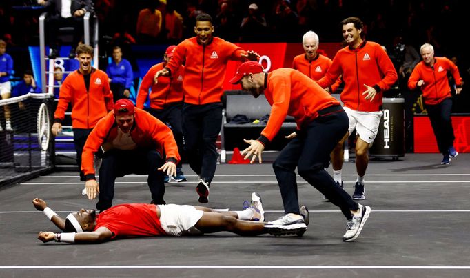 Tennis - Laver Cup - 02 Arena, London, Britain - September 25, 2022 Team World's Frances Tiafoe celebrates with teammates after winning his match and the Laver Cup agains