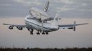 The space shuttle Discovery, attached to a modified NASA 747 aircraft, takes off in Cape Canaveral