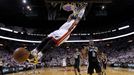 Miami Heat's Dwyane Wade (3) dunks on San Antonio Spurs' Kawhi Leonard (2) during Game 7 of their NBA Finals basketball playoff in Miami, Florida June 20, 2013. REUTERS/M