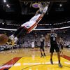Miami Heat's Wade dunks on Spurs' Leonard during Game 7 of t