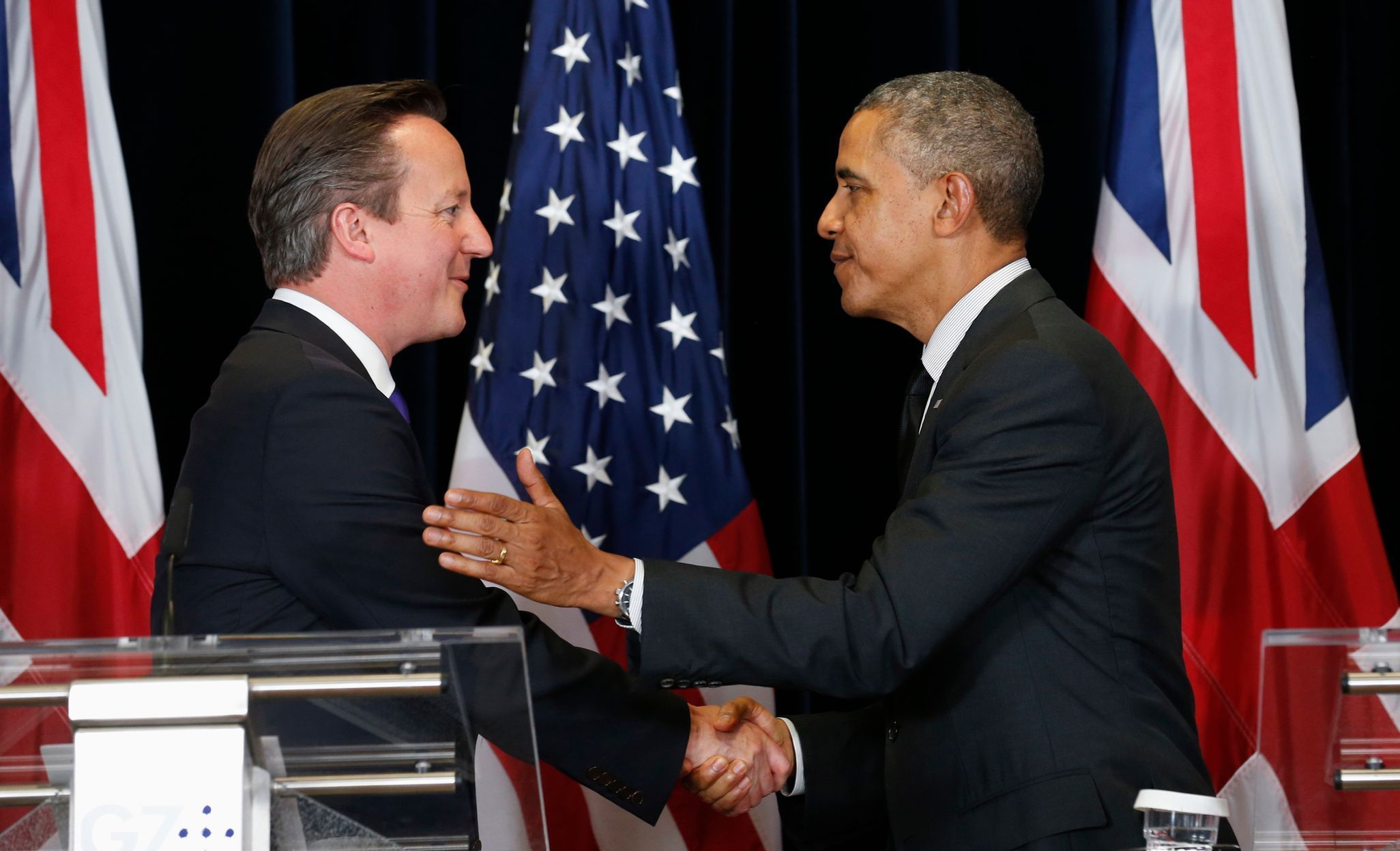 U.S. President Barack Obama and British Prime Minister David Cameron shake hands after holding a news conference at the G7 Summit in Brussels