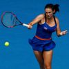 Vesna Dolonc of Serbia hits a return to Serena Williams of the U.S. during their women's singles match at the Australian Open 2014 tennis tournament in Melbourne