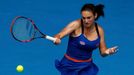 Vesna Dolonc of Serbia hits a return to Serena Williams of the U.S. during their women's singles match at the Australian Open 2014 tennis tournament in Melbourne January